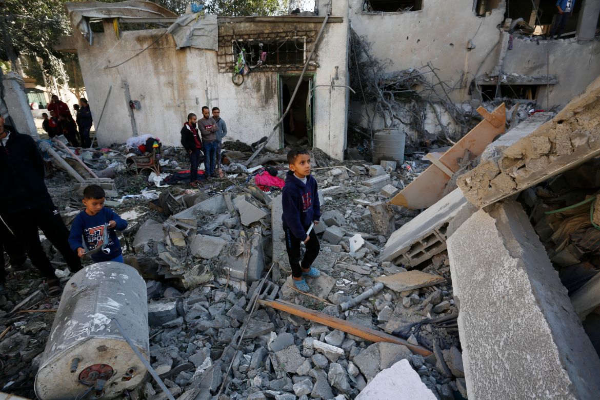 A Palestinian child stands amongst the rubble of buildings destroyed in Israeli attacks in Nuseirat refugee camp located five kilometers north east of Deir al Balah, Gaza.