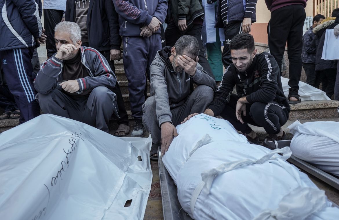 Relatives of the Palestinians died in Israeli attacks, mourn as they receive the dead bodies from the morgue of An-Najjar Hospital for a funeral ceremony while the Israeli attacks continue in Rafah, Gaza.