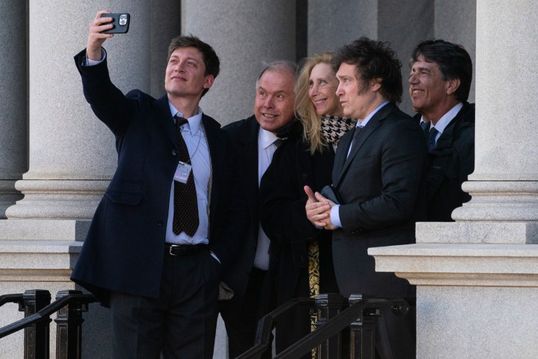 Javier Milei and his team stop for a group selfie on the steps of the White House.