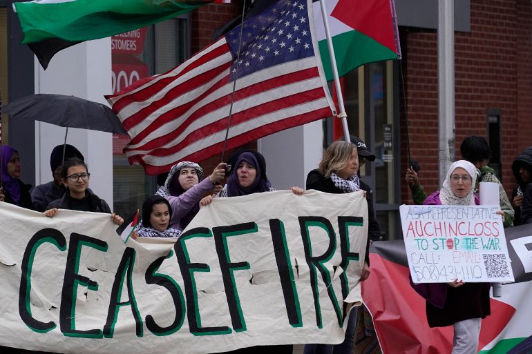 Pro-Palestinian demonstrators display signs during a protest in the United States.