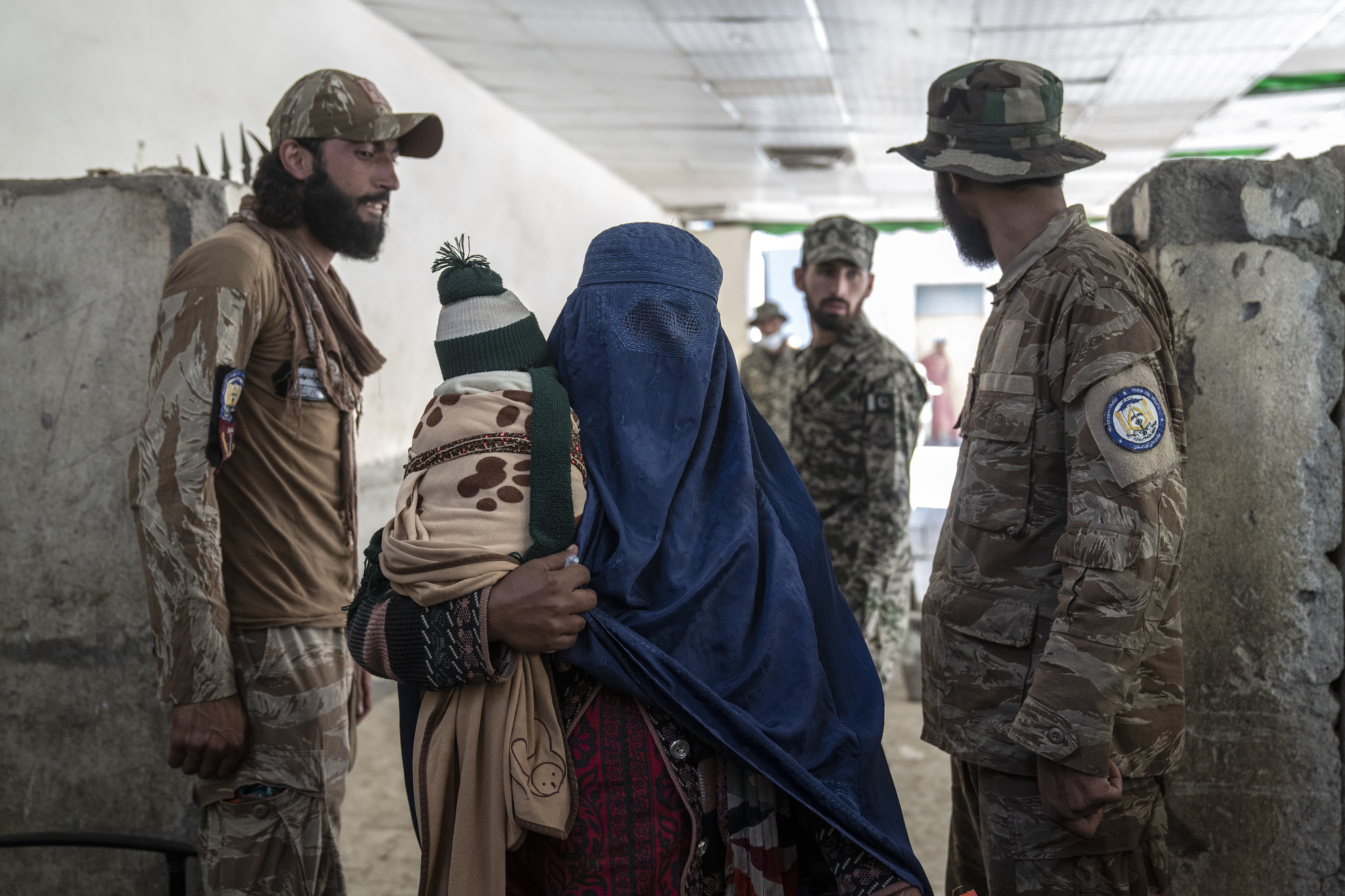 An Afghan refugee woman returns to Afghanistan through the Pakistan-Afghanistan border in Torkham, Afghanistan, Friday, Nov. 3, 2023