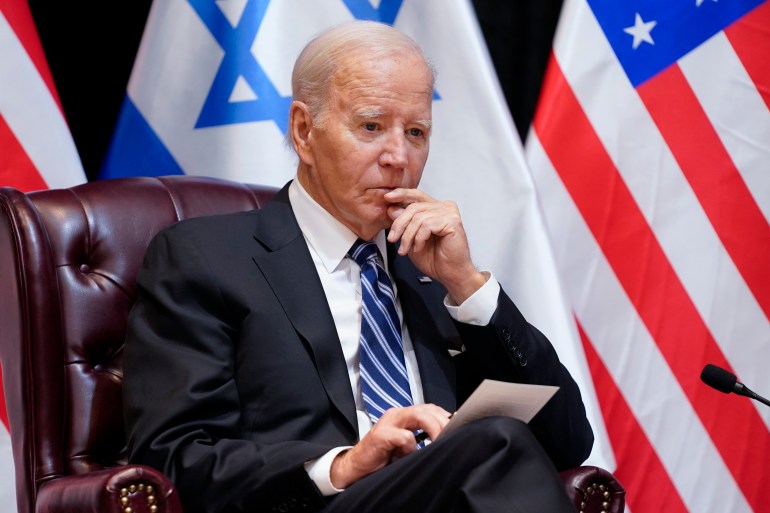 President Joe Biden listens as he and Israeli Prime Minister Benjamin Netanyahu participate in an expanded bilateral meeting with Israeli and U.S. government officials, Wednesday, Oct. 18