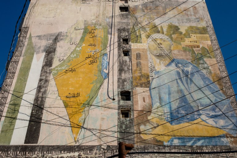 A mural on a building showing a map of Palestine