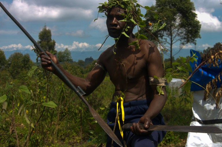 A member of the Wazalendo, a loose coalition of militia groups, poses for a photo on the outskirts of Goma in May