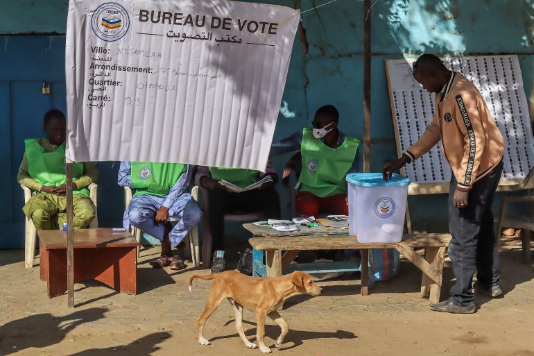 A man casts his vote at a polling station during the constitutional referendum in N'Djamena, on December 17, 2023. [Denis Sassou Gueipeur / AFP]