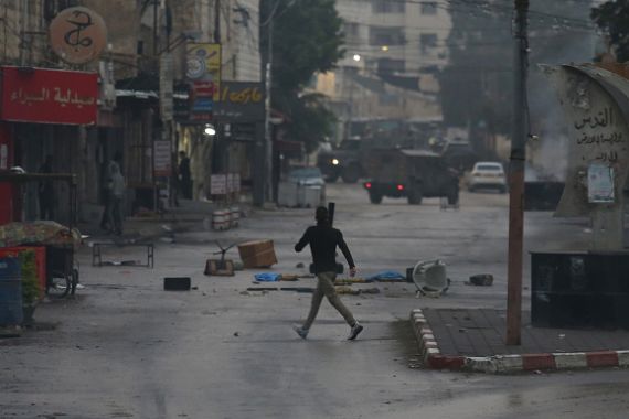 A view of the street as the clash breaks out between Palestinians and Israeli forces following the raid, conducted by Israeli army, on Jenin refugee camp in Jenin, West Bank on December 5.