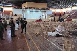 Security personnel survey the damage at Mindanao State University&#039;s gymnasium [Provincial Government of Lanao Del Sur/Facebook]