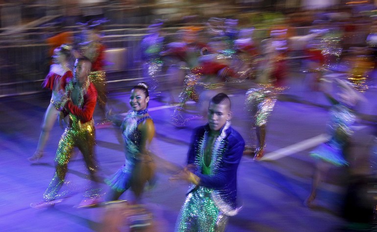 The streets of Cali, Colombia, are a blur of bodies as salsa dancers twist and twirl in a parade.