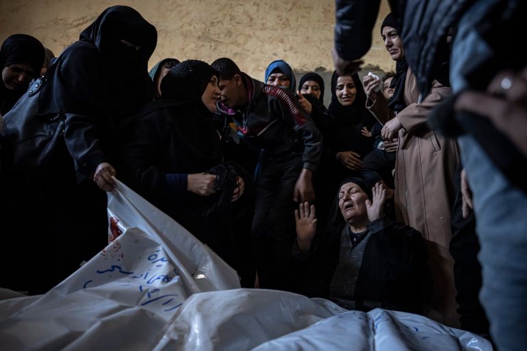 Members of the Abu Sinjar family mourn their relatives killed in the Israeli bombardment of the Gaza Strip, at their house in Rafah, southern Gaza, on January 5, 2024.