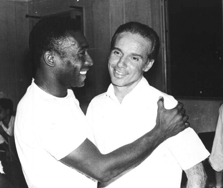 FILE - Brazil's soccer star Pele, left, embraces Mario Zagallo after the latter's appointment as coach of the Brazilian national soccer team, in Rio De Janeiro, Brazil, in March 1970. Zagallo, who reached the World Cup final a record five times, winning four, as a player and then a coach with Brazil, has died. He was 92. Brazilian soccer confederation president Ednaldo Rodrigues said in a statement in the early hours of Saturday, Jan. 5, 2024, confirming Zagallo's death that Zagallo "is one of the biggest legends" of the sport. (AP Photo, File)