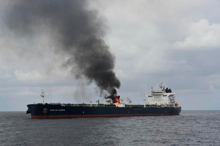 In this photo provided by the Indian Navy on Saturday, Jan. 27 a view of the oil tanker Marlin Luanda on fire after an attack, in the Gulf of Aden