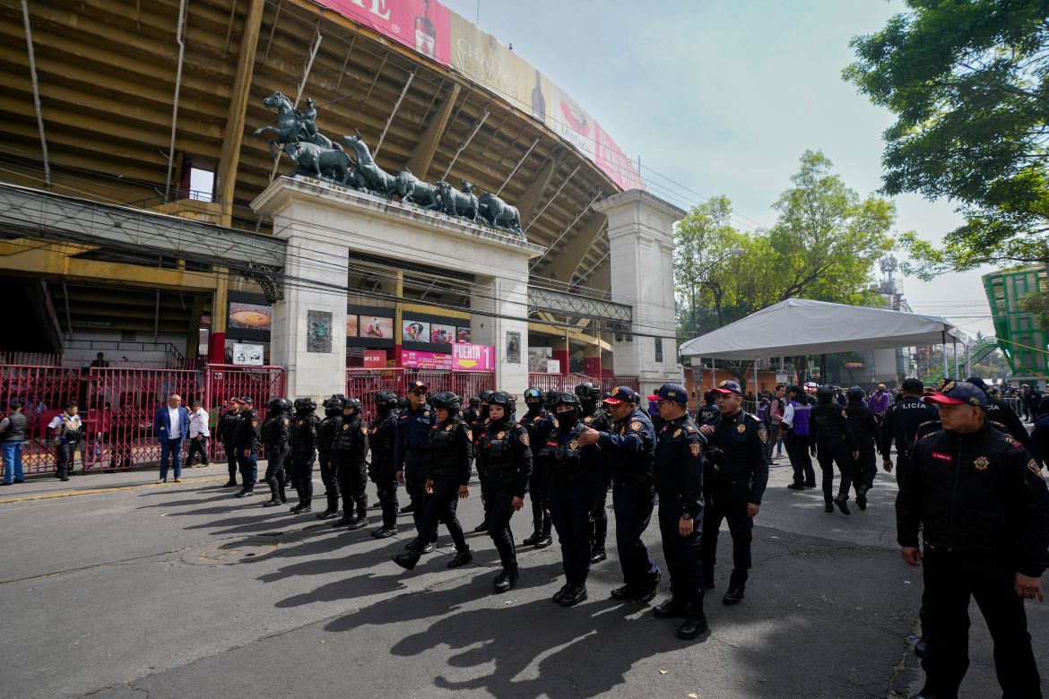 Police agents stand guard at the Plaza Mexico