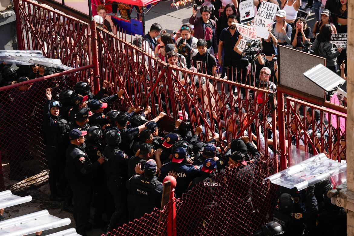Police block a gate as animal rights activists try to enter the Plaza Mexico,