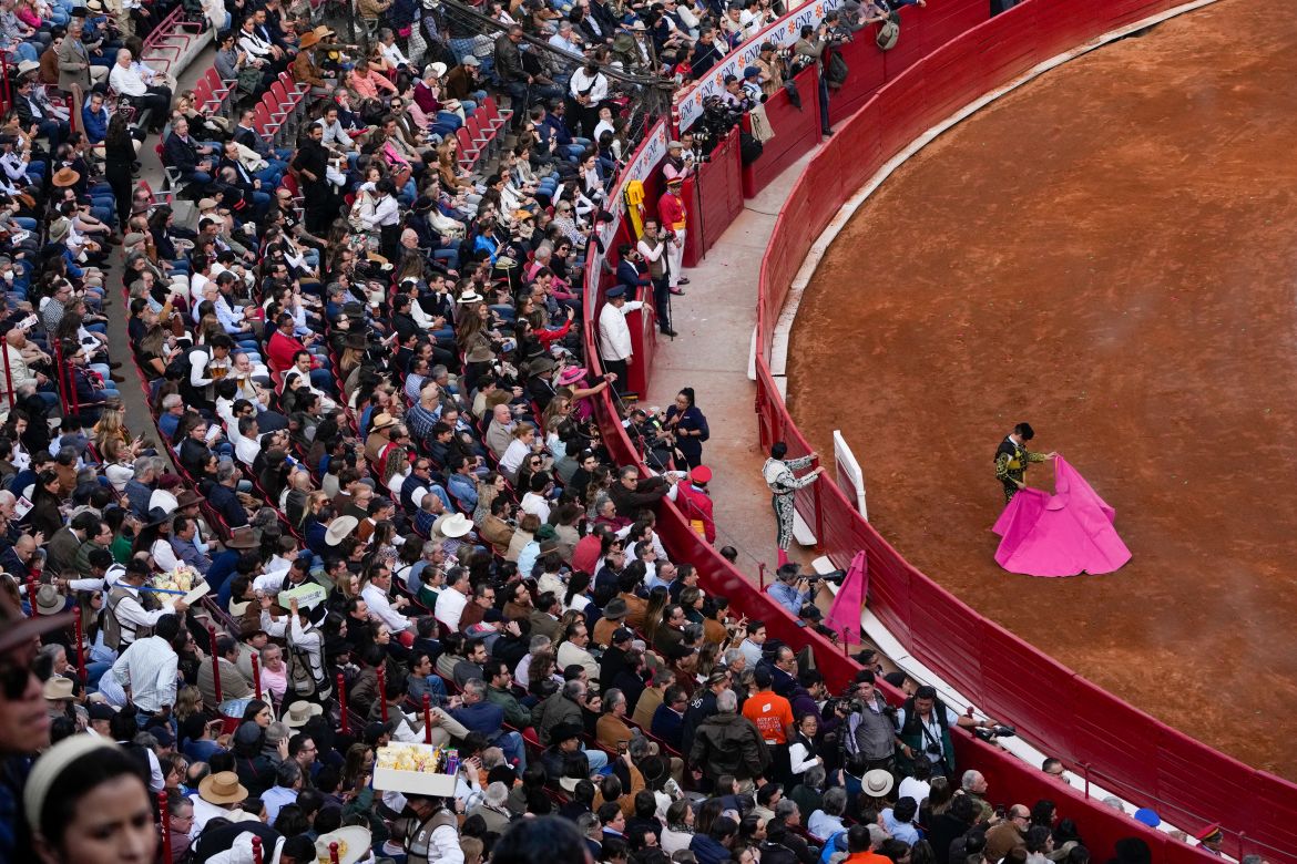 Spectators watch a bullfight at the Plaza Mexico,