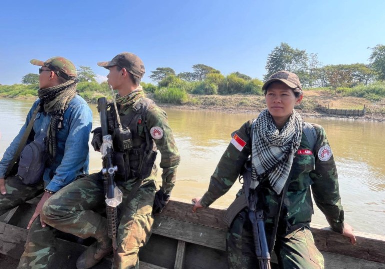Ma Wai from the Bamar People's Liberation Army. She is on a boat with other fighters.