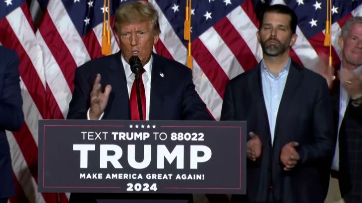 Trump speech in front of podium in Iowa.