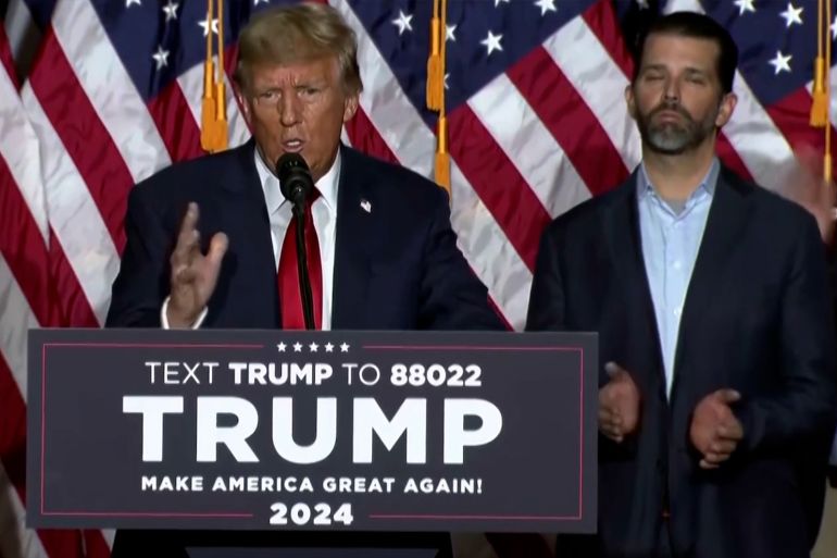 Trump speech in front of podium in Iowa.