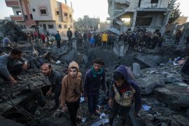 Palestinians search for bodies and survivors among the rubble following an Israeli airstrikes on the west of Al Nusairat refugee camp, southern Gaza Strip, on February 20, 2024 [Mohammed Saber/EPA]
