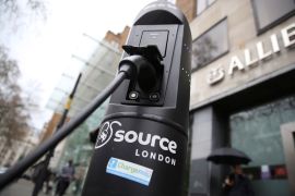 An electric car is plugged into a charging point in London