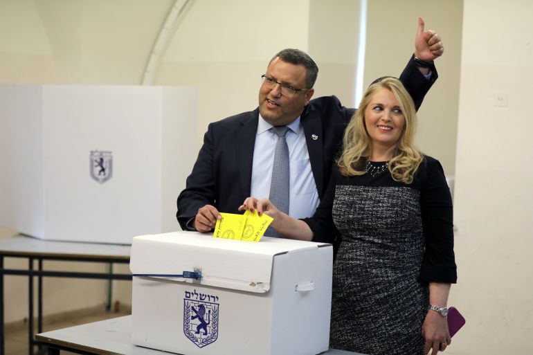 Jerusalem mayoral candidate Moshe Lion and his wife cast their votes in the second round of local council elections in Jerusalem November 13, 2018. REUTERS/Ammar Awad