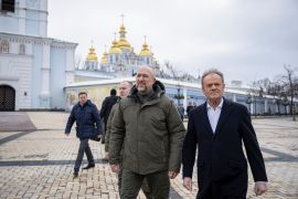 Polish Prime Minister Donald Tusk and his Ukrainian counterpart Denys Shmyhal walk at Mykhailivksa Square after visiting the Memory Wall of Fallen Defenders of Ukraine in Kyiv [File: Viacheslav Ratynskyi/Reuters]