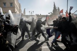 Greek university students clash with riot police amid tear gas,during a demonstration against a planned bill which opens the way for the operation of private universities, in Athens, Greece, February 1