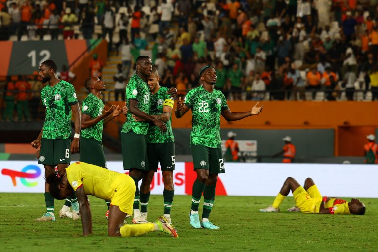 Nigeria's Kenneth Omeruo and teammates celebrate after the match