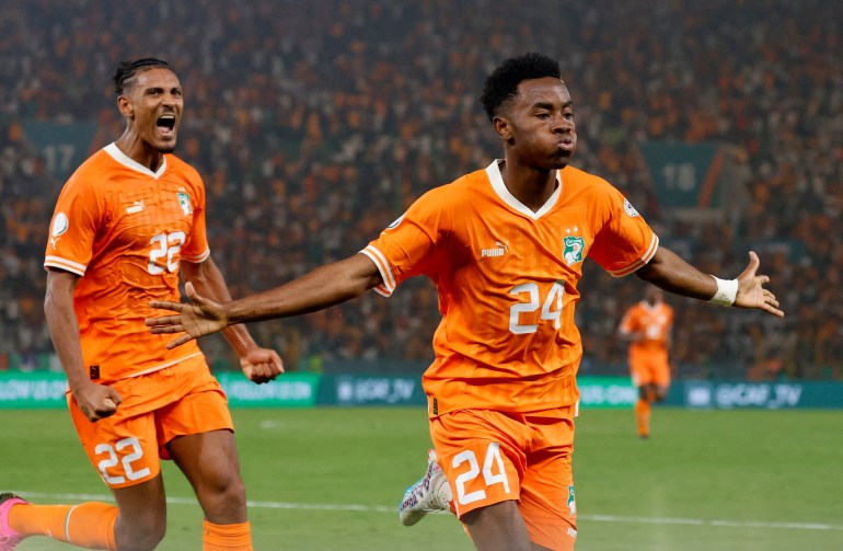 Ivory Coast's Simon Adingra celebrates scoring their first goal