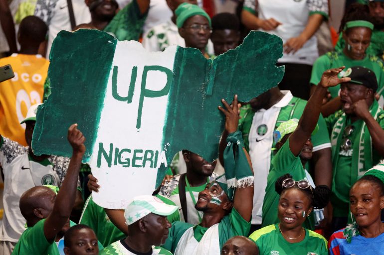 Africa Cup of Nations - Semi Final - Nigeria v South Africa - Stade de la Paix, Bouake, Ivory Coast - February 7, 2024 Nigeria fans celebrate after reaching the Africa Cup of Nations final