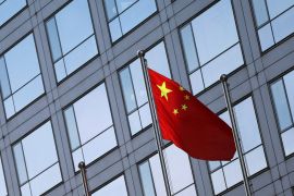 A Chinese flag flutters outside the China Securities Regulatory Commission building on Financial Street in Beijing, China February 8, 2024 [Florence Lo/ Reuters]