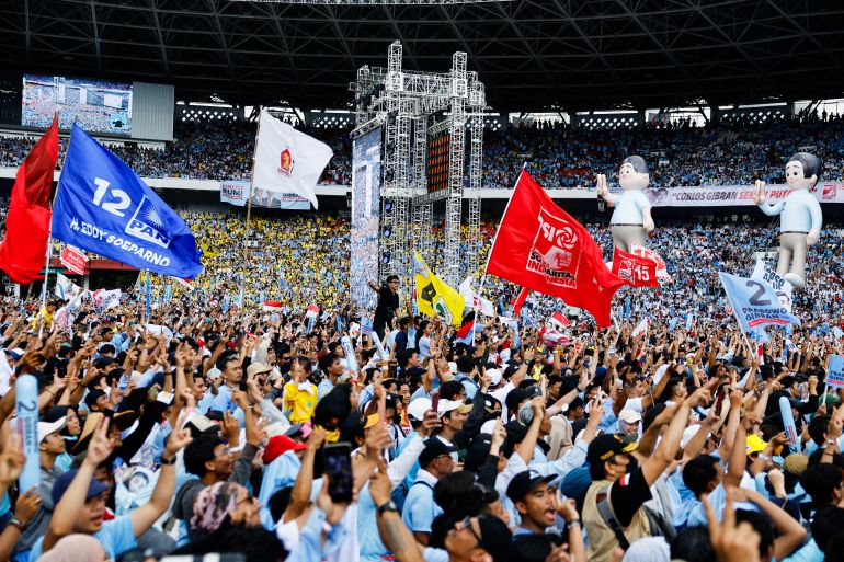 Supporters of Indonesia's Defence Minister and presidential candidate Prabowo Subianto and his running mate Gibran Rakabuming Raka, react at their campaign rally in Jakarta, Indonesia February 10, 2024