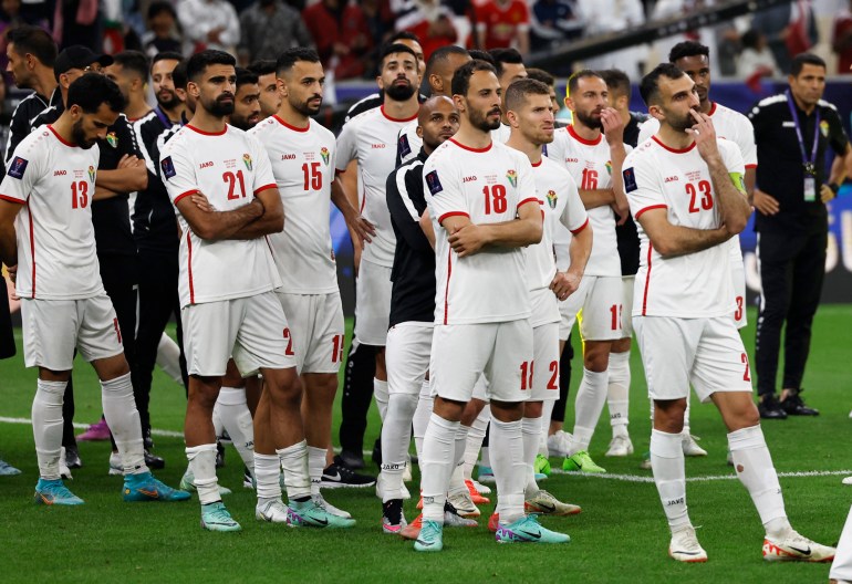 Soccer Football - AFC Asian Cup - Final - Jordan v Qatar - Lusail Stadium, Lusail, Qatar - February 10, 2024 Jordan players look dejected after the match REUTERS/Thaier Al-Sudani