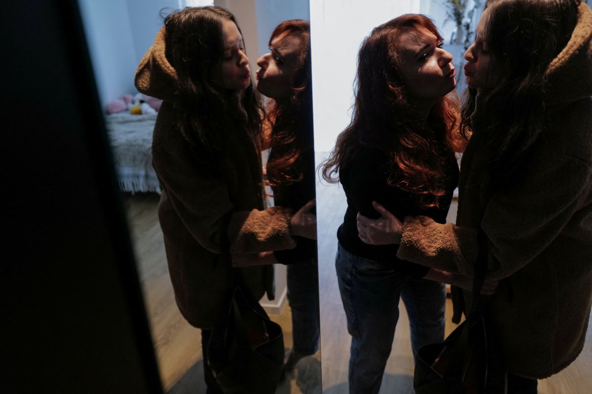 Tetiana Chykalova kisses her daughter Marharyta Chykalova, 16, from Kherson, before Marharyta leaves for theatre class, at their apartment in Gdynia, Poland, February 17
