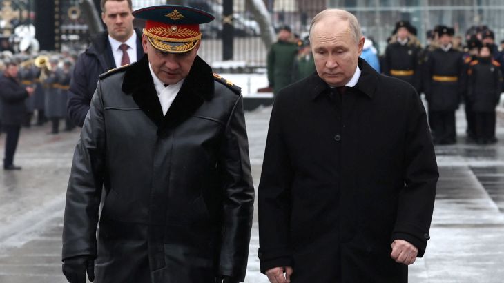 Russia's President Vladimir Putin and Defence Minister Sergei Shoigu speak after a wreath laying ceremony marking Defender of the Fatherland Day at the Tomb of the Unknown Soldier by the Kremlin Wall in Moscow, Russia, February 23, 2024. Sputnik/Alexander Kazakov/Pool via REUTERS ATTENTION EDITORS - THIS IMAGE WAS PROVIDED BY A THIRD PARTY.