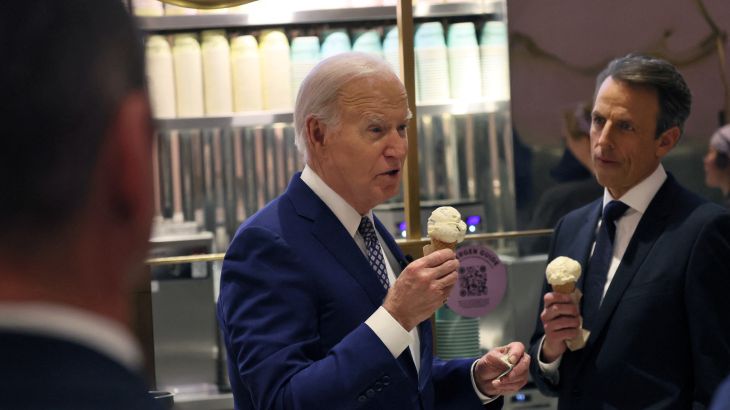 President Joe Biden answers a question from a journalist as he visits an ice cream shop in downtown New York