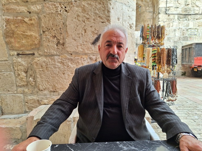 Fakhri Abou Diab drinks tea and greets friends at al-Aqsa Mosque [Mat Nashed/Al Jazeera]