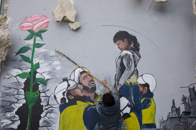 A mural showing civil defense teams (White Helmets) rescuing a girl from under the rubble after the earthquake in northwestern Syria.