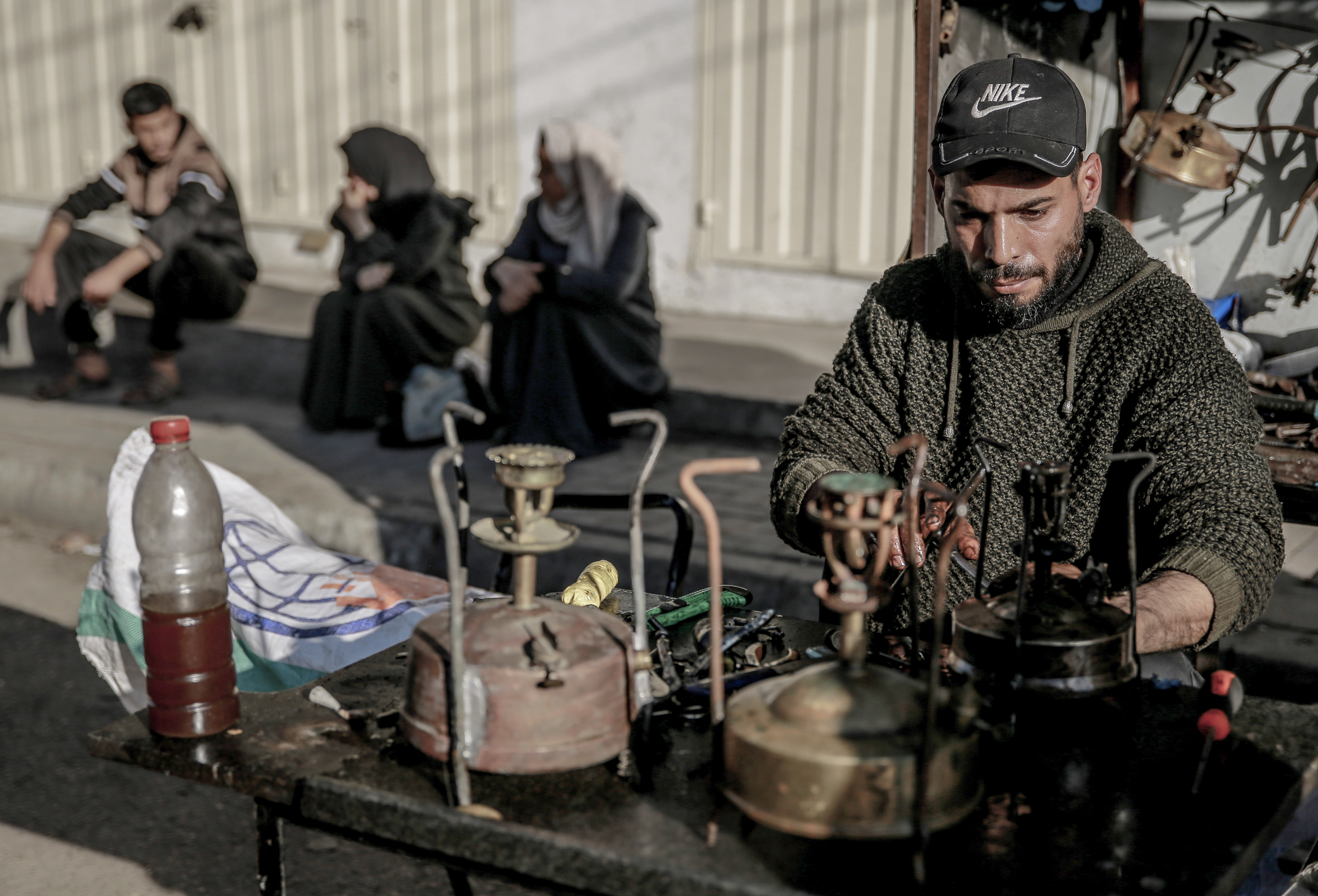 37-year-old Mahmoud Al-Najjar repairs old kerosene stoves and makes them usable again as Palestinian people have resorted to old methods of cooking due to the full embargo imposed by Israel on Gaza, on February 21