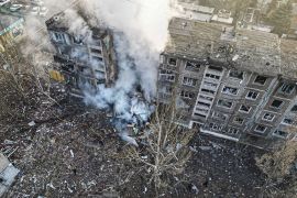 A view of a smouldering apartment building in Selydove after a Russian missile attack