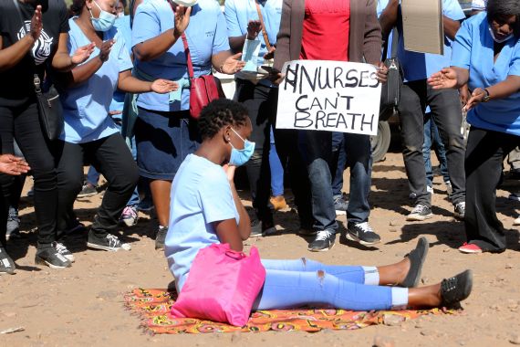 Nurses take part in a protest at a government hospital in Harare