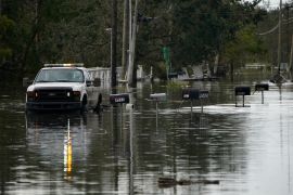 Mailboxes line a flooded street in the aftermath of Hurricane Ida
