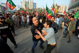 Pakistani Police detain supporter of former prime minister Imran Khan and political party Pakistan Tehreek-e-Insaf (PTI) during an election campaign rally in Karachi, Pakistan, Sunday, Jan. 28, 2024. Pakistani police fired tear gas to disperse supporters of former Prime Minister Imran Khan in the southern city of Karachi on Sunday, less than two weeks before a national parliamentary election that Khan was blocked from running in because of a criminal conviction. (AP Photo/Fareed Khan)
