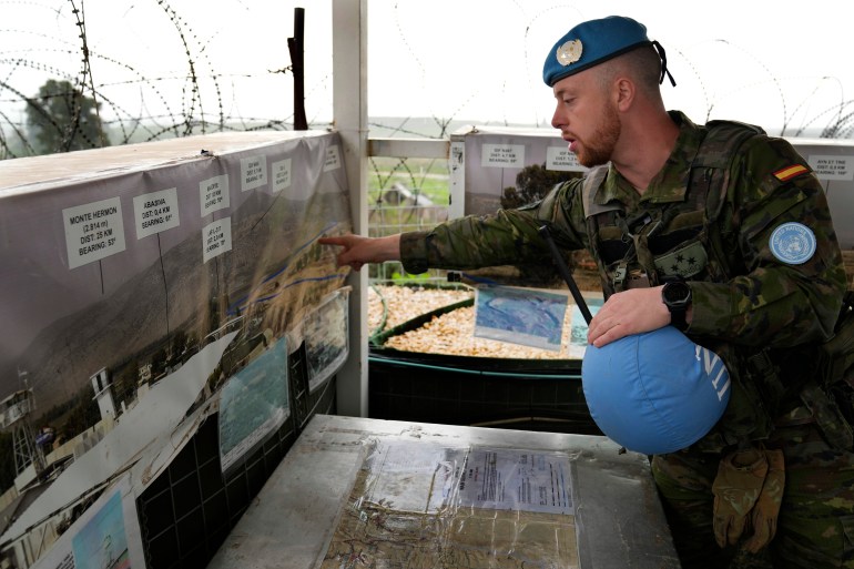 Hector Alonso Garcia of the Spanish UNIFIL battalion shows on a map the blue line