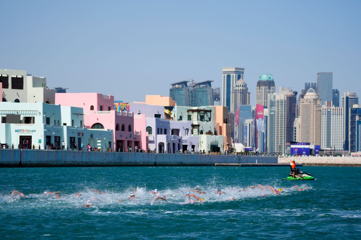 Athletes compete in the men's 10 km open water final at the World Aquatics Championships in Doha, Qatar, Sunday