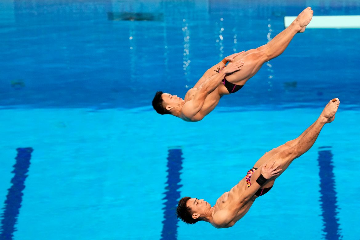 Tze Liang Ooi and Muhammad Syafiq Puteh of Malasyia compete during the men's 3 m synchronised diving final at the World Aquatics Championships in Doha, Qatar, Sunday, Feb. 4