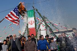 Demonstrators burn a U.S. flag during their annual rally commemorating Iran's 1979 Islamic Revolution in Tehran, Iran, Sunday