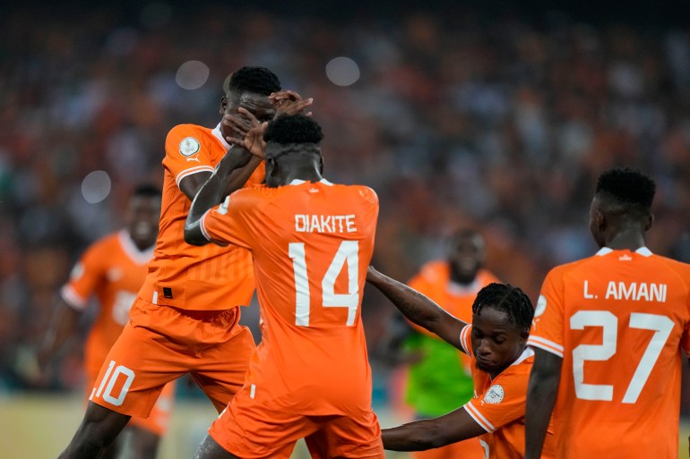 Ivory Coast players celebrate their win after the African Cup of Nations final soccer match between Nigeria and Ivory Coast, at the Olympic Stadium of Ebimpe in Abidjan, Ivory Coast, Sunday, Feb. 11, 2024. (AP Photo/Sunday Alamba)