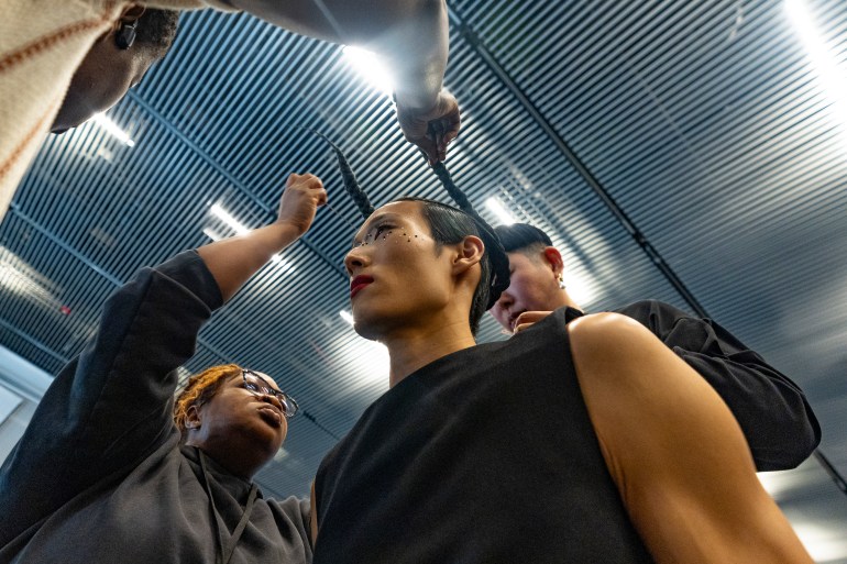 Models are prepped before the Thom Browne fall/winter 2024 fashion show during New York Fashion Week