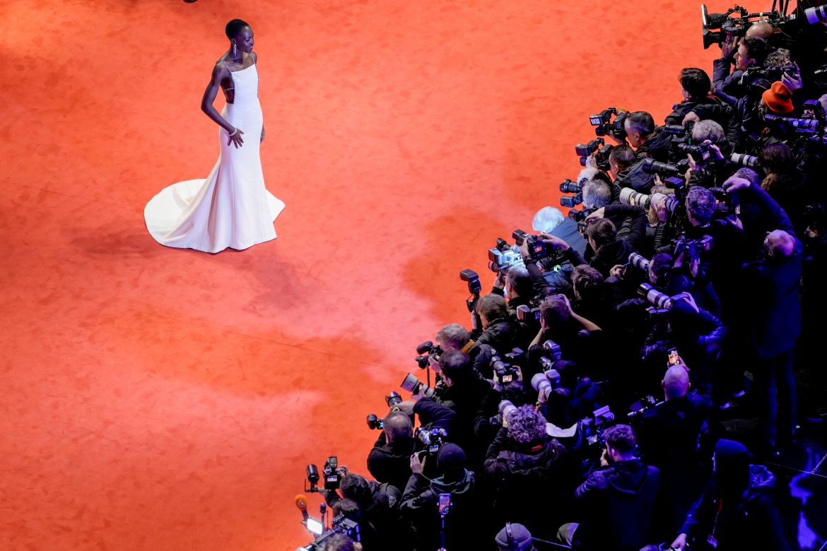 The president of the International Jury Lupita Nyong'o stands on the red carpet leading to the Berlinale Palast for the opening of the International Film Festival, Berlinale,in Berlin, Thursday, Feb. 15