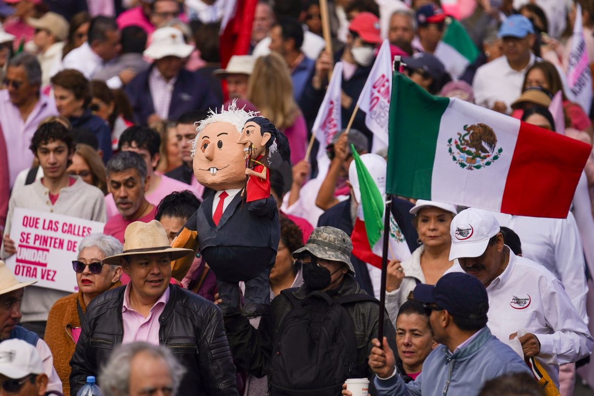 People take parte in a march organized by citizen organizations demanding that electoral autonomy be respected in the upcoming general elections in downtown Mexico City